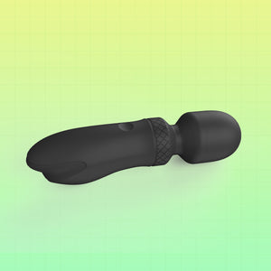 Black personal massager with a textured grip band, shown on a green and yellow gradient background with a grid pattern.