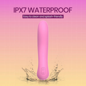 Pink waterproof personal massager standing upright in a splash of water against a pink-to-yellow gradient background with text reading 'IPX7 WATERPROOF' and 'Easy to clean and splash-friendly'.