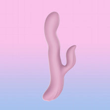 A pink silicone personal massager with a wavy, organic shape and a smaller curved arm, shown against a pastel pink-to-blue gradient background.